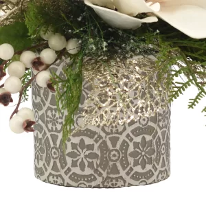 Magnolia with Evergreen and Berries in a Decorative Ceramic Vase